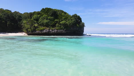 Aerial-View-of-Crystal-Clear-Water-at-Pantai-Watu-Bella-In-Sumba-Island,-Indonesia