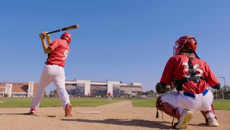 baseball player misses the ball during a game