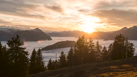 golden sunset above cloud sea in swiss highlands