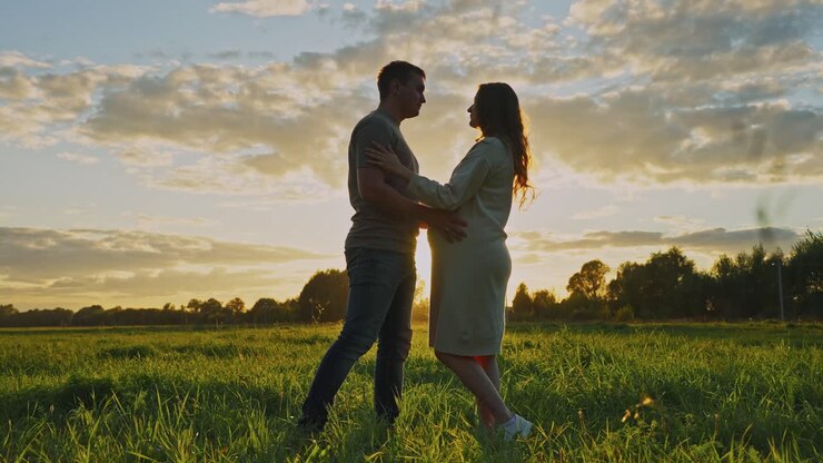 Pregnant Couple at Sunset