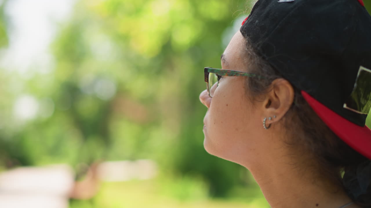 Young person observes distant woods, Young teenager pauses to stare at distant forested landscape, An youthful adolescent silently contemplates expansive view of faroff woodland scenery