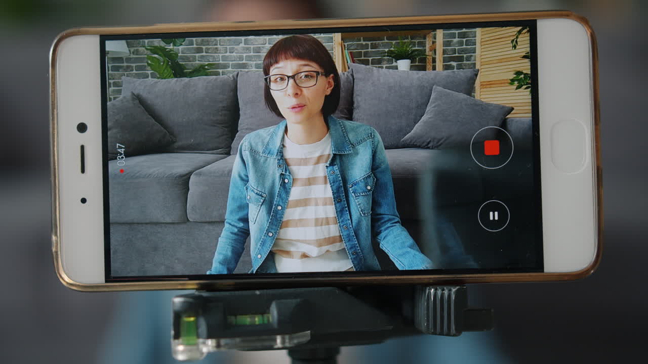 Woman Recording Video on Smartphone