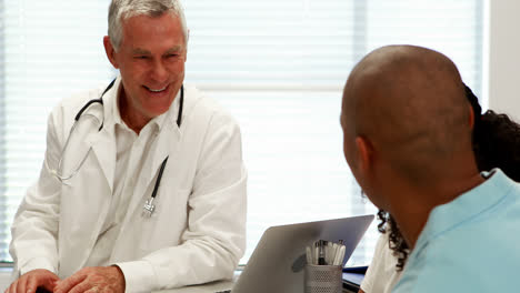 male doctor and patient interacting with each other