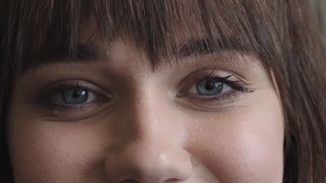 close-up-woman-blue-eyes-looking-at-camera-smiling-happy-beautiful-caucasian-female