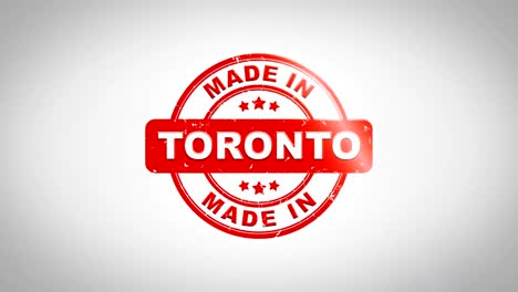 hecho en toronto firmado estampado texto estampado animación de sello de madera. tinta roja en papel blanco limpio fondo de superficie con fondo matte verde incluido.