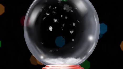 animation of christmas snow globe with snow flakes on black background