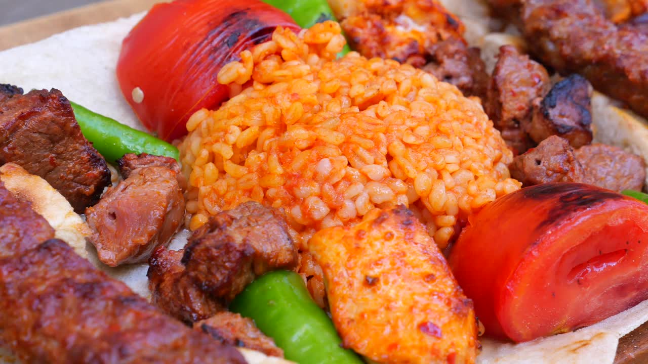 Close-up of a Turkish Kebab Platter with Rice, Grilled Vegetables, and Meats