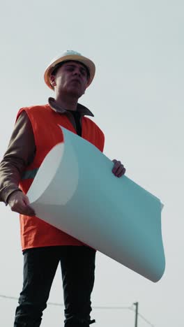 architect outdoor with the project map surrounded by the sky