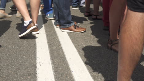 view of people walking down the street, blurred image, invisible faces