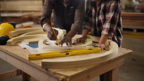 carpenters collaborating on a woodworking project