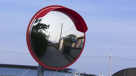 timelapse shot of the traffic curve mirror in asia