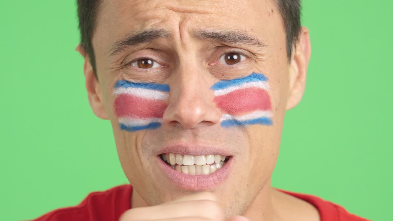 Very nervous man supporting costa rican team during a difficult match