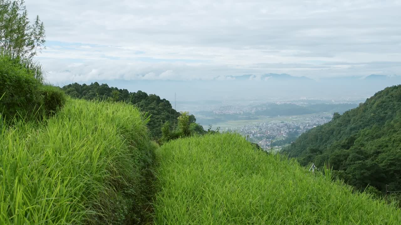 Rural Scenery and Kathmandu in Nepal, Rice Fields Paddies and Paddy Fields Terraces in a Rural Village in Kathmandu Valley with the City Behind, Rural Village Scene