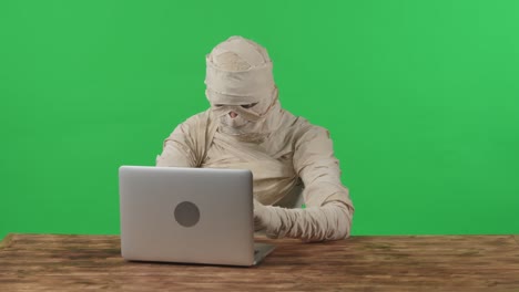 green screen isolated chroma key video capturing a mummy dancing and singing actively into the