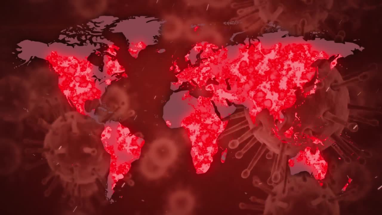 la palabra covid-19 escrita con células de coronavirus que se propagan y un mapa del mundo en fondo rojo.