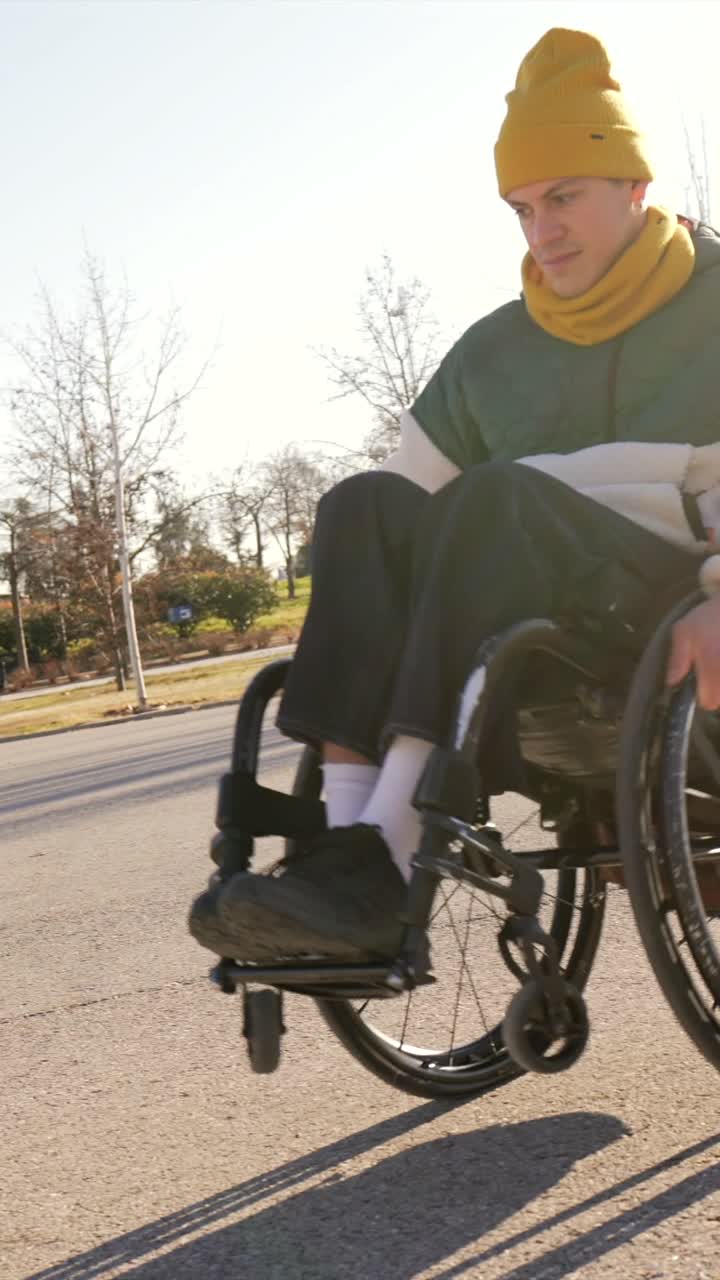 Person in wheelchair outdoors in autumn