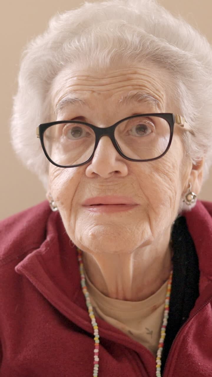 Senior woman with spectacles looking at camera in a geriatric