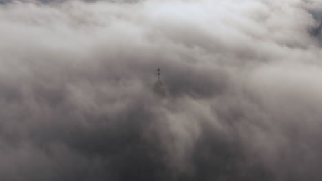 Dense-fog-over-Wawel-Castle-in-Krakow,-Poland-with-slightly-visible-tower