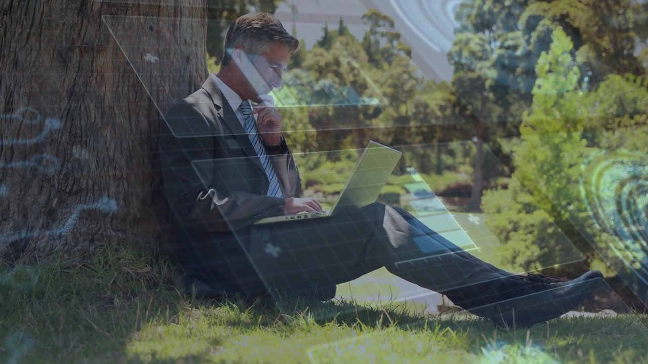 Businessman Working on Laptop Outdoors with Digital Data Overlay