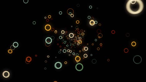 abstracto hermoso flujo aleatorio de formas redondas de colores en fondo negro, efecto 3d. animación. muchos anillos pequeños moviéndose hacia la cámara.