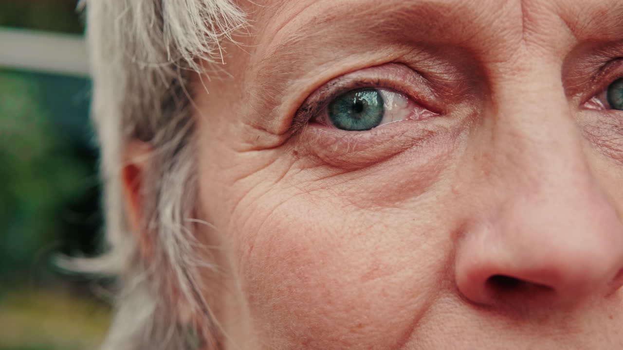Close Up of Senior Woman's Blue Eye Blinking