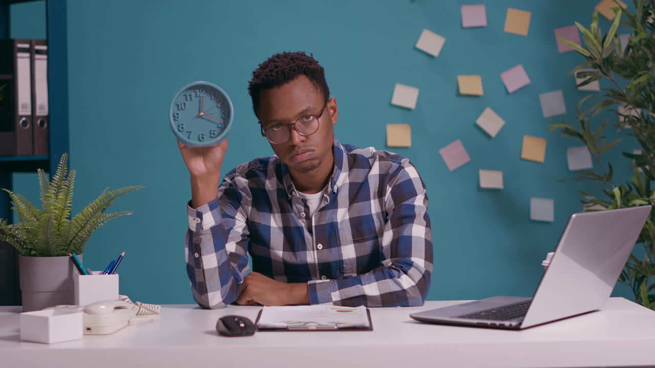 Man showing time on clock and feeling disappointed about deadline