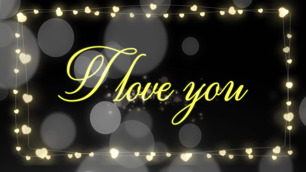 I love you text animation with glowing hearts and bokeh lights
