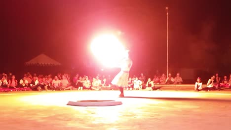 male kalbeliya dancer in traditional tribal dress performing fire dance near thar desert jaisalmer.