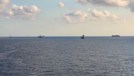 cargo ship parked parked in the middle of the ocean moving view