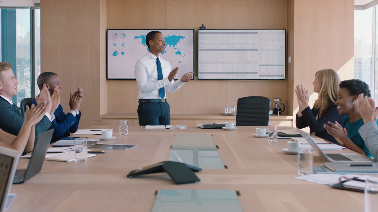 business people celebrating victory team leader man congratulating male executive for successful sales company shareholders clapping hands in office boardroom meeting