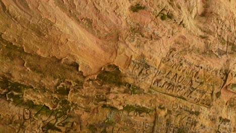 panning shot from historical inscriptions at gutman's cave, gauja national park, latvia