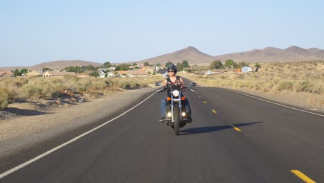 woman motorcyclist with dog