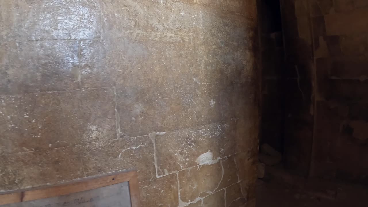POV entering ancient stone building at Giza pyramid complex in Egypt