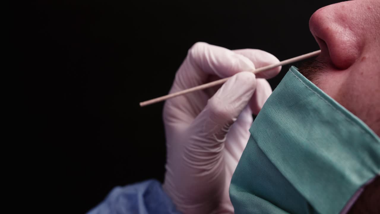 Medical Professional Performing Nasal Swab COVID-19 Test