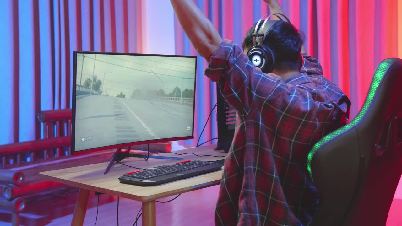 Male Gamer Celebrates Victory Car Race Game