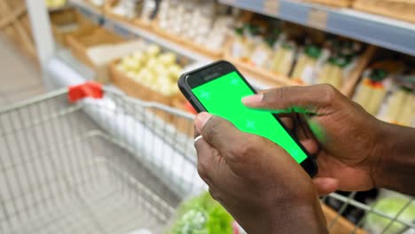 person using a smartphone in a grocery store