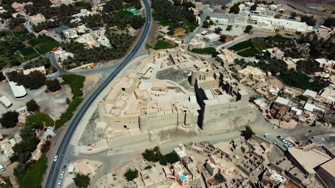 Aerial view of Bahla Fort, Oman! This 13th-century UNESCO fortress is a symbol of Oman's rich history. Watch now!