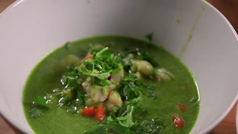 Serving-Of-Nutritious-Hot-Seafood-Cilantro-Soup-In-A-Bowl---close-up,-static-shot