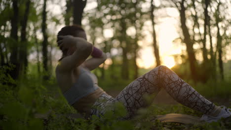 a woman exercising in a forest
