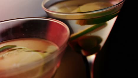 lemon slices and olives in the glass of cocktail