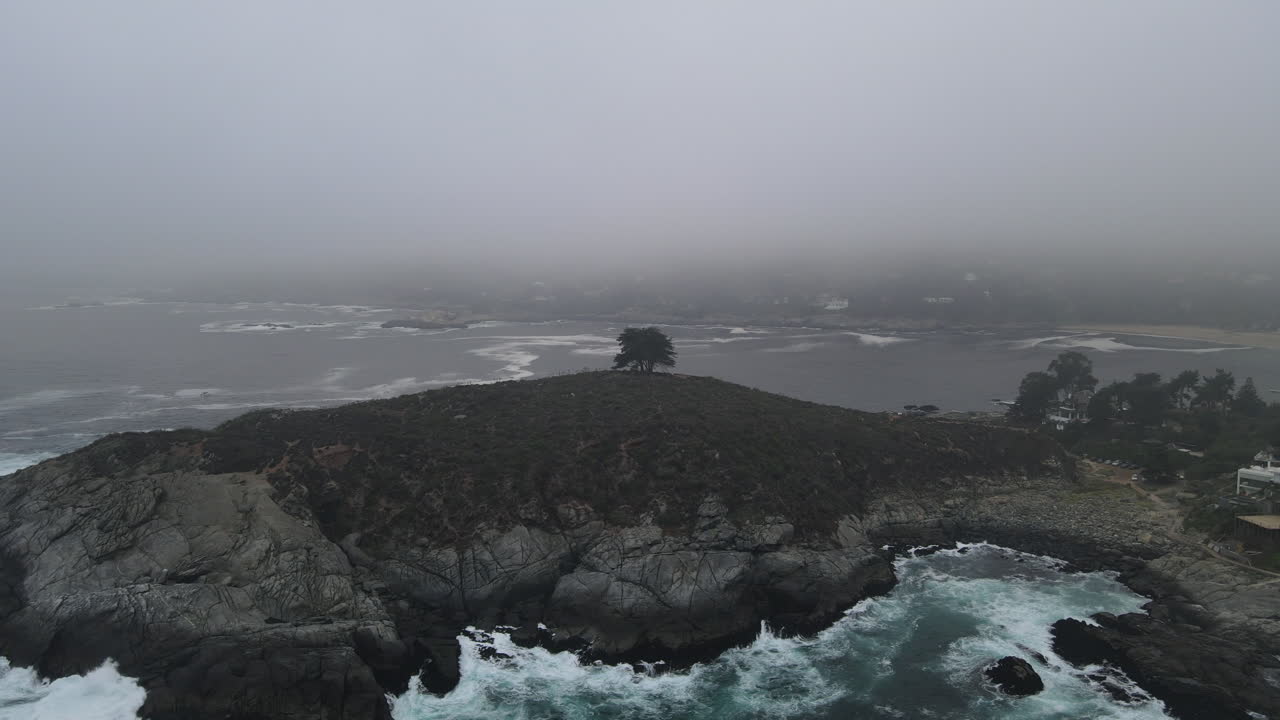 AERIAL - Foggy Cerro de la Cruz, Zapallar, Valparaiso, Chile, scenic circle shot