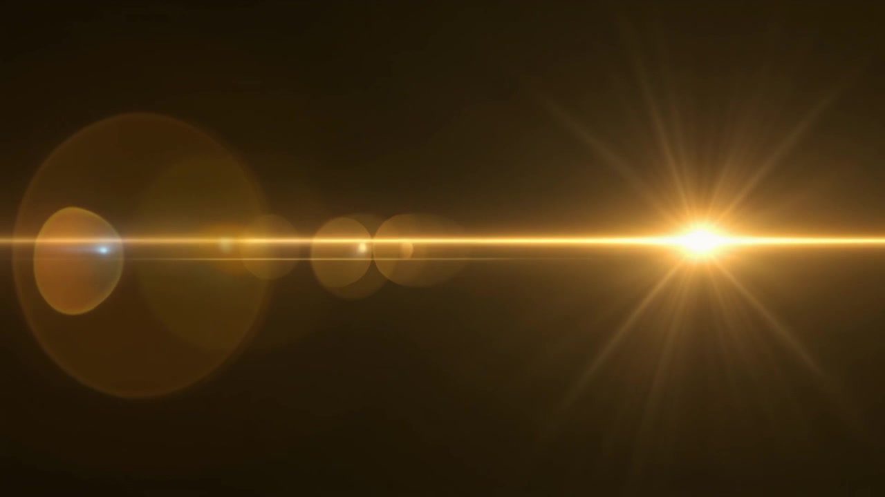 Effetto Flare Lente Dorato su Sfondo Scuro