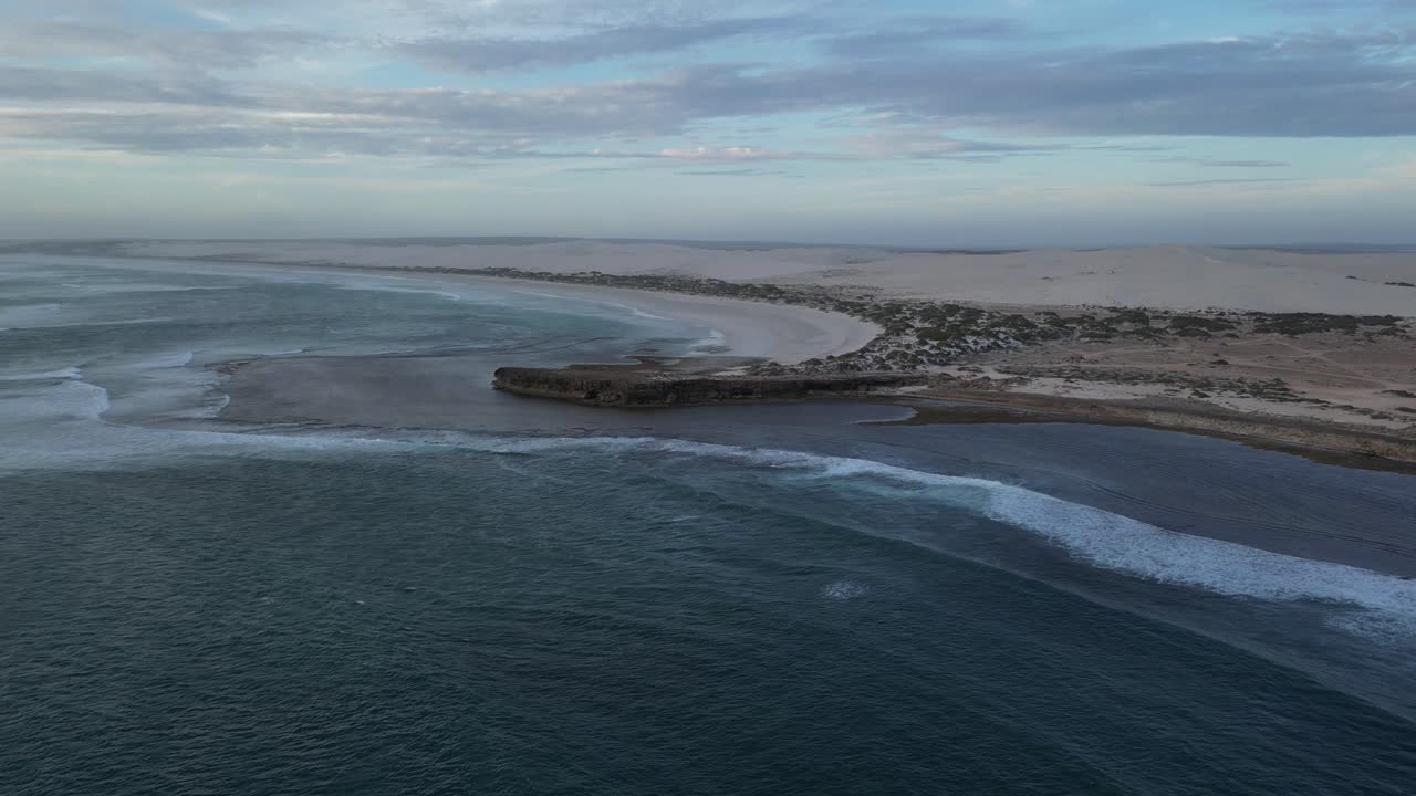 Aerial View of Stunning Coastal Landscape with White Sand Dunes and Turquoise Ocean
