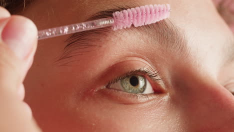 Applying eyebrow brush
