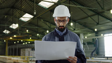 Caucasian-engineer-wearing-helmet-and-glasses