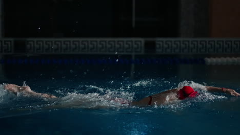 woman swimming freestyle in a pool