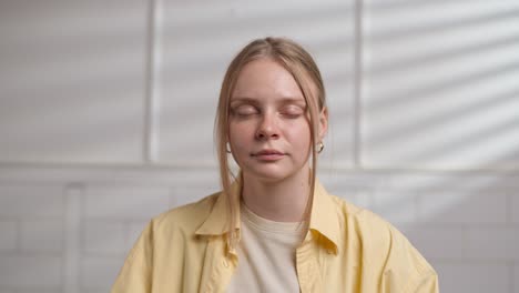 young woman in yellow shirt