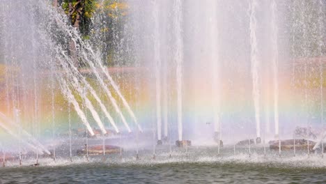 colorful rainbow forms in fountain spray