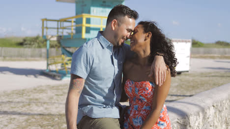 Happy-multiracial-couple-on-seafront
