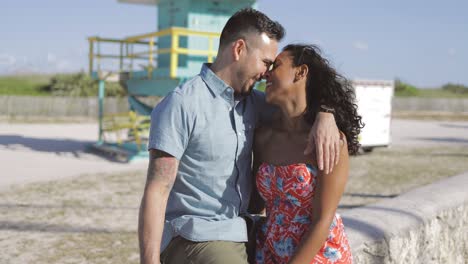 happy multiracial couple on seafront